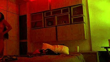 Linda Houston dances seductively under the full red light, captivating everyone with her moves