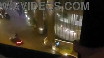 sharing private pleasure outdoors by hotel window