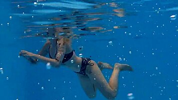 casual-narrative cute blonde mimi cica swimming underwater in pool