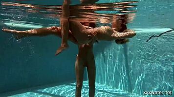 stefanie moon and vyvan hill splashing underwater in pool