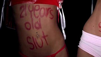 Young Binca, just 18, kneels bound in tight ropes. She sucks obediently under strict command.