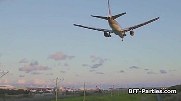 three sexy stewardesses sharing a big dick on land