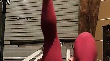 Muscular blonde milf teases in gym, undressing leggings for striptease