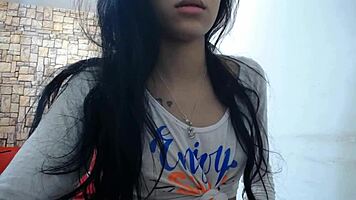 Young latina cam girl with glasses in solo performance