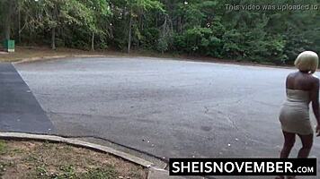 Ebony girl MsNovember squatting pissing public in skirt upskirt heels.