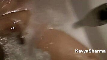 Indian babe Kavya fingers her tight pussy in bathtub with Hindi audio