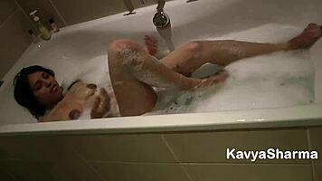 Indian babe Kavya fingers her tight pussy in bathtub with Hindi audio