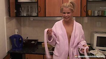 Cutie Fondles Shaved Pussy With Toy In Kitchen