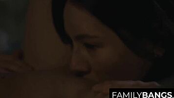 petite teens share midnight kisses in family setting