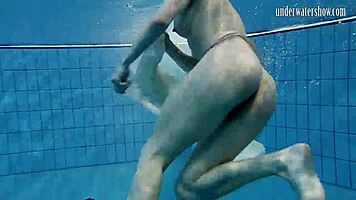 Dark-Haired Teen Andrea Floating with Stunning Beach Curves