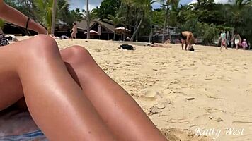 Girl flashes her pussy without panties while eating sushi on a crowded public beach