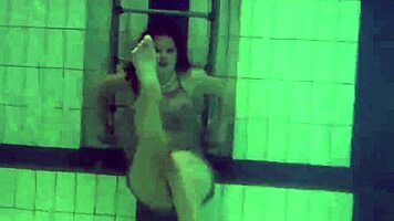 Katya Okuneva is at the pool, bouncing her tits in a dress and bikini