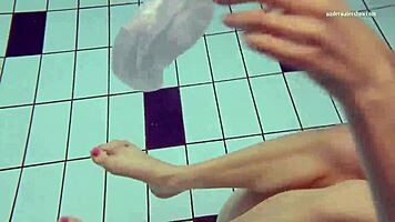 Nastya volna swims gracefully underwater like a wave in the pool