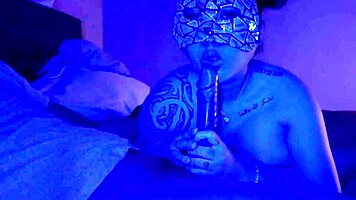 Asian woman performs sloppy deepthroat blowjob on big black cock, her big tits bouncing.