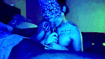 Asian woman performs sloppy deepthroat blowjob on big black cock, her big tits bouncing.