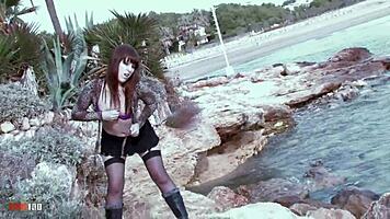 hey, watch allya the hot brunette babe rip her clothes off on the beach rocks, teasing with her small tits and stockings?
