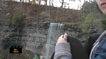 blonde gives outdoor blowjob at waterfall, almost caught