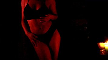 she dances in the dark, slowly removing her panties
