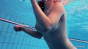 redheaded katrin teasingly stripping underwater 😏