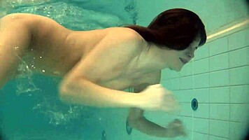Natalia Kupalka swims naked in the pool, looking cute