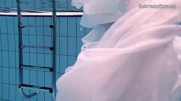 aqua girl andrejka strips underwater in pool