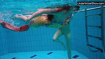 bubarek and birtakik splash and tease each other underwater in the pool, brunette teens in bikinis