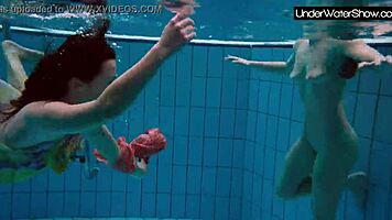 bubarek and birtakik splash and tease each other underwater in the pool, brunette teens in bikinis