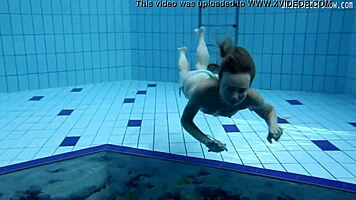 look at clara's small tits underwater in the pool