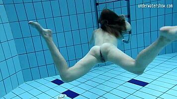 look at clara's small tits underwater in the pool