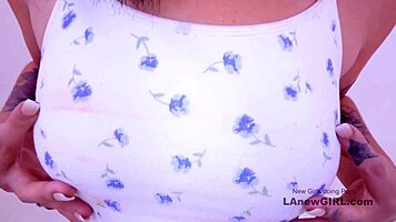 Hot brunette squirting from fuck machine between her legs.