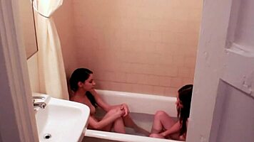 Cutie brunettes in lingerie kiss passionately before fucking shaved pussies.