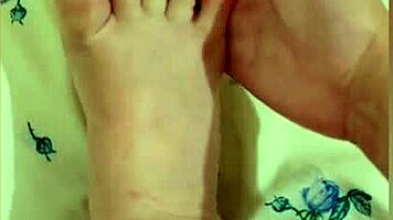Young Babe Strokes Sexy Feet With Pink Pedicure
