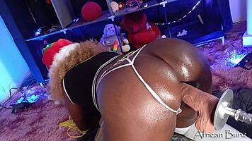 Hey, check out this ebony babe on the fuck machine with BBC dildo, she's moaning so loud!