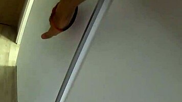 Behind the scenes, skinny lesbian with small tits gets kissed and groped by man while having sex with two cocks