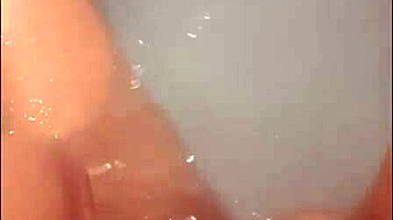 pretty woman enjoys solo masturbation in hot tub