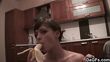 Dagfs - freckled-face babe plays with her dildo on kitchen counter, ripping clothes and exposing small 18+ tits and shaved pussy.