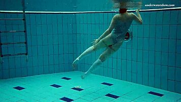 Dasha Explores Underwater Depths At The Beach