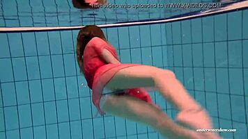 Look at those firm big tits bouncing in that red dress underwater, she says, poolside with the russian brunette duna bultihalo.