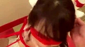 Stunning teen brunette in a tightCORSET:], wearing bondage restraints and cat ears costume performs a fake blowjob