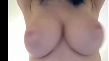 Blue haired 18yo shows off her huge breasts on webcam