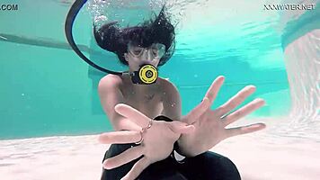 Brita piskova pleasures herself underwater in the pool, showing tits and ass