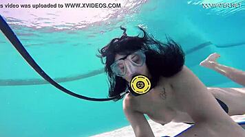 Brita piskova pleasures herself underwater in the pool, showing tits and ass