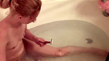 blonde petite 18+ emi clear shaves her legs and her little 18+ pussy