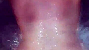 Sexy milf aggressively fucks her young boyfriend in the hot tub, showing off her big tits and ass.