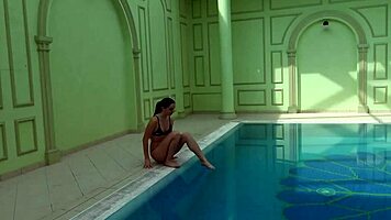 kittina ivory undresses in the swimming pool