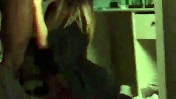 Young woman in dorm gives interracial blowjob