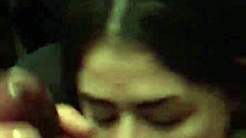 Young woman in dorm gives interracial blowjob