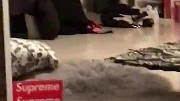 Young woman in dorm gives interracial blowjob