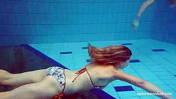 Marusia and melisa darkova bathe in bikini underwater.