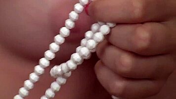 cute yankee blonde evalina enjoys solo fun with pearls, masturbating her clit to orgasm.